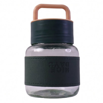 Glass water bottle with white background highlighting sleek design