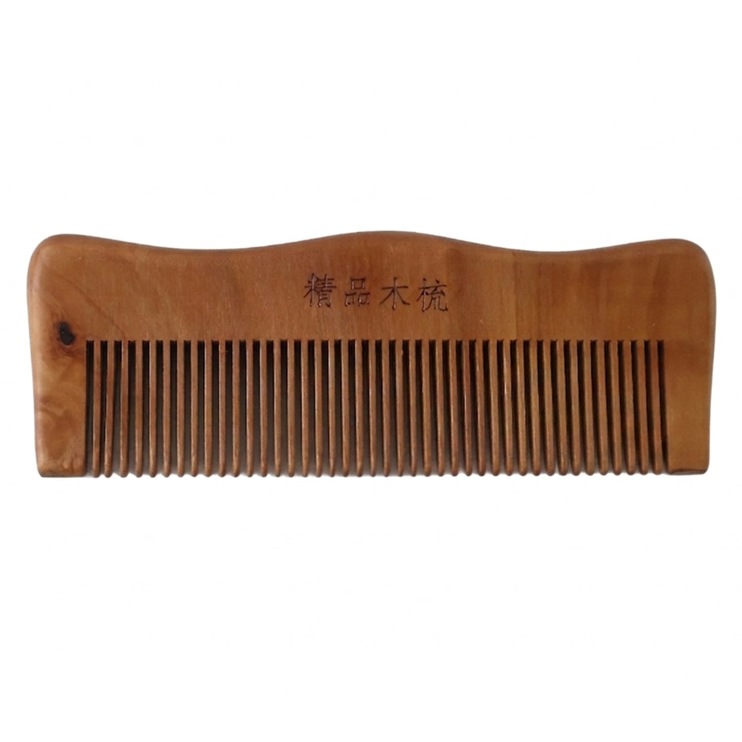 Wooden comb on white background highlighting natural wood finish