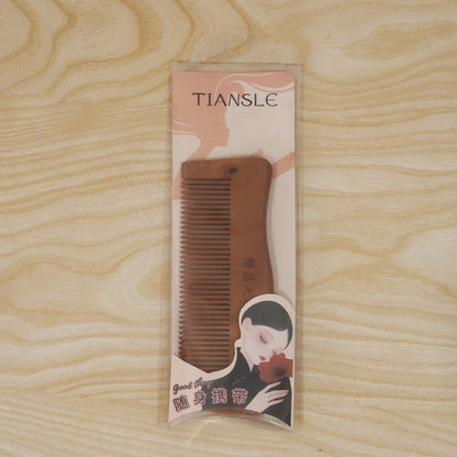Beautiful wooden comb in packaging, ideal gift for hair care enthusiasts