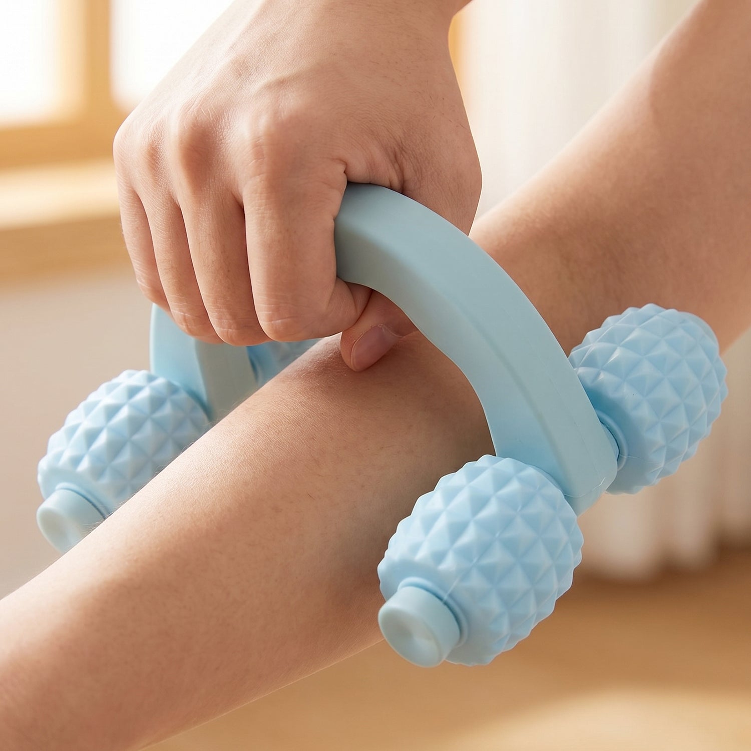 User demonstrating massage on leg with the device.