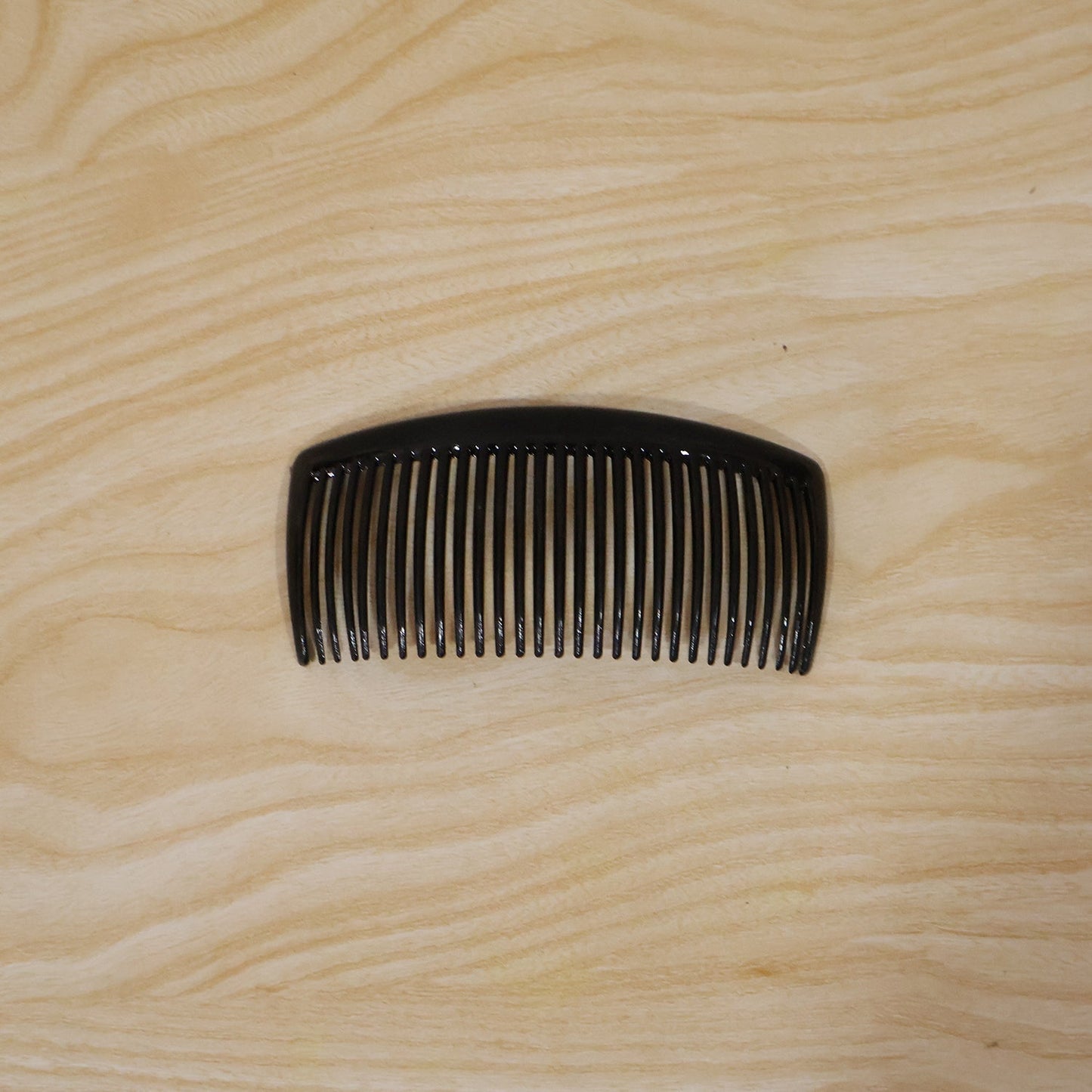 Packaged plastic hair comb for everyday use