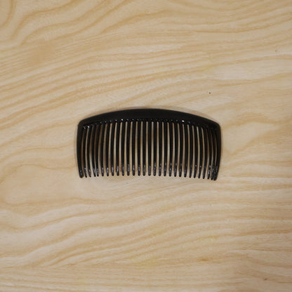 Packaged plastic hair comb for everyday use