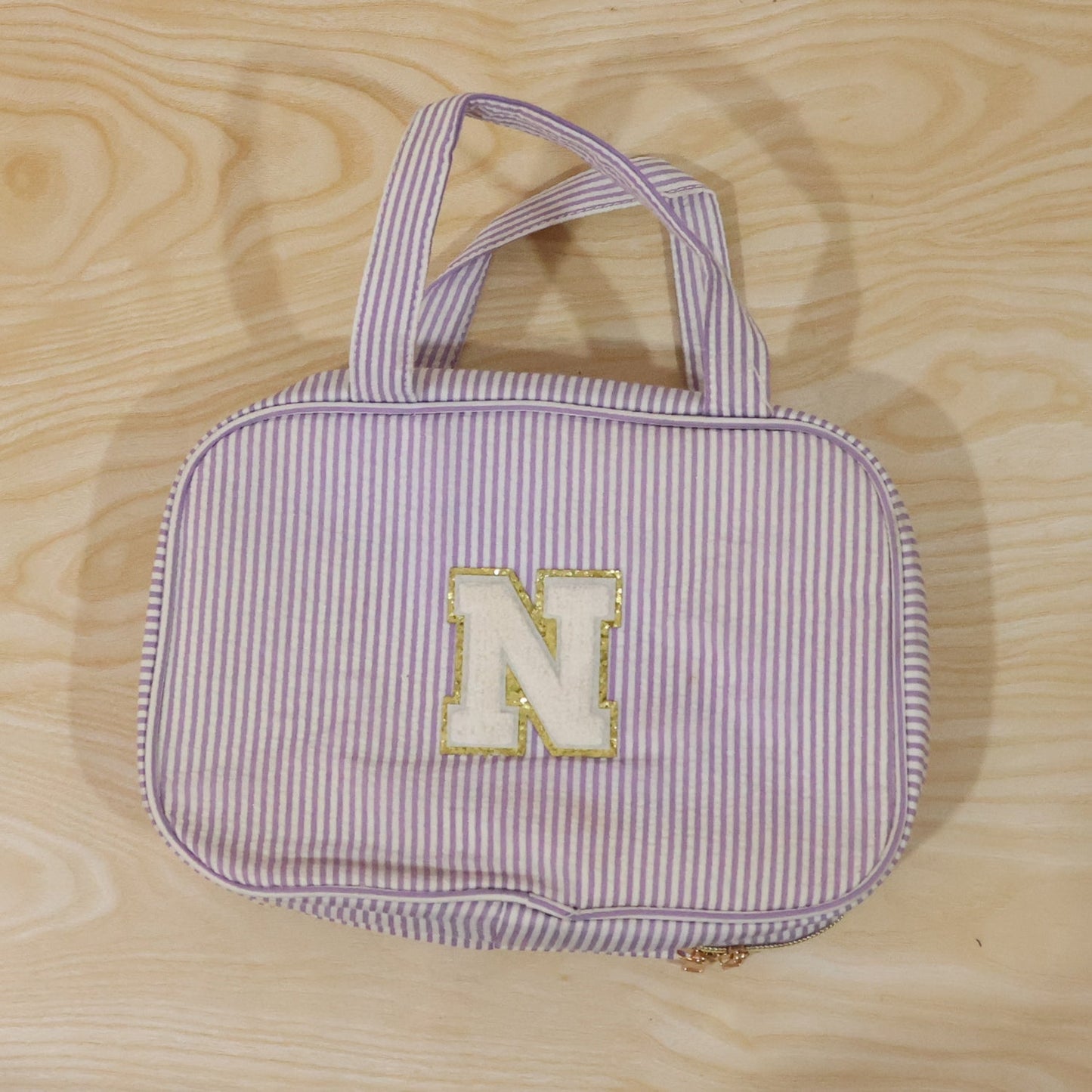 Detailed view of multi-pocket toiletry pouch with compartments
