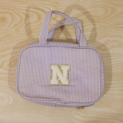 Detailed view of multi-pocket toiletry pouch with compartments