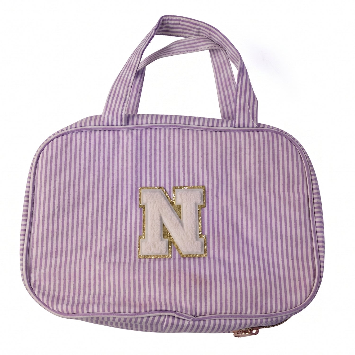 Travel toiletry bag placed on a white background