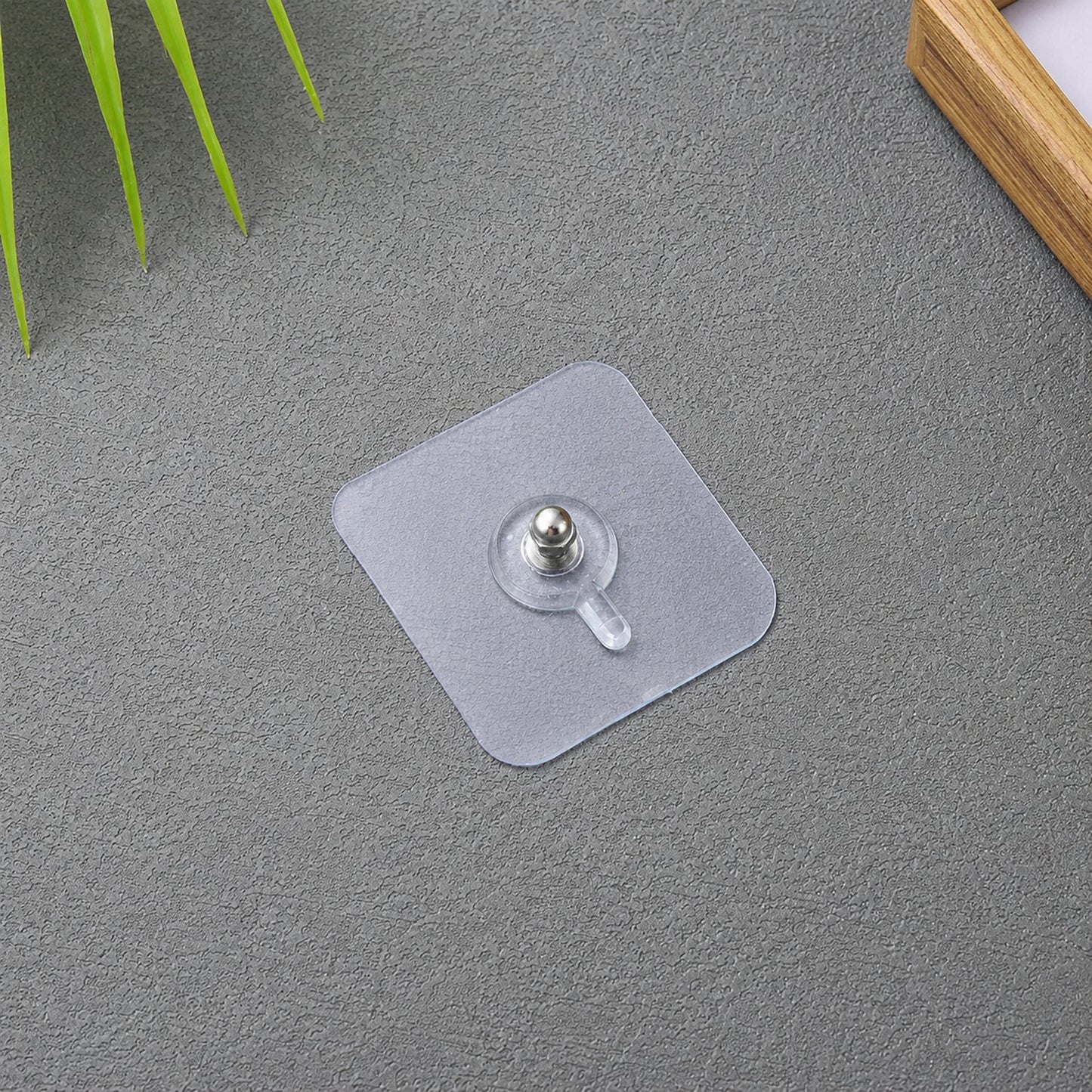 Transparent self adhesive wall hook for hanging photo frames and clocks