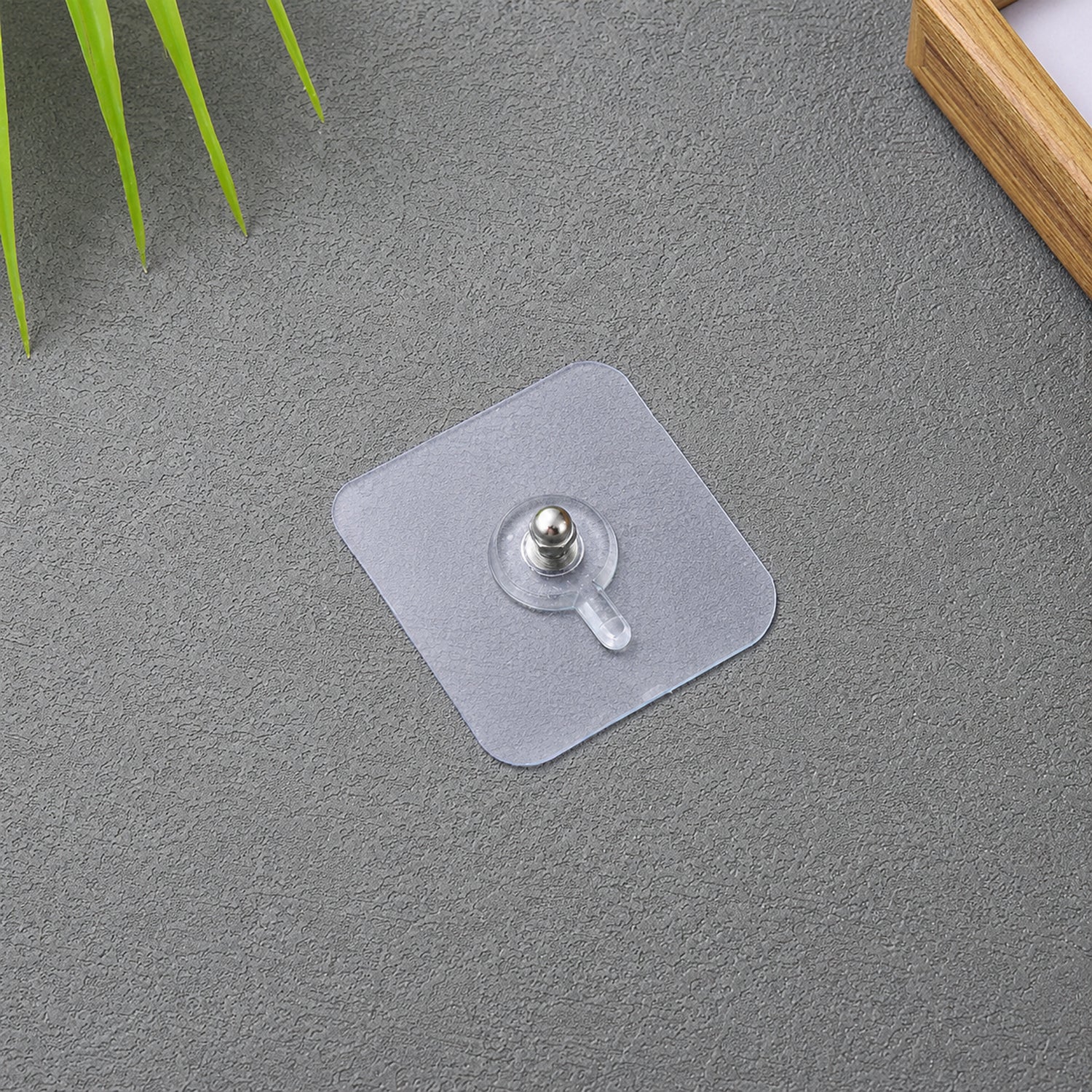 Transparent self adhesive wall hook for hanging photo frames and clocks