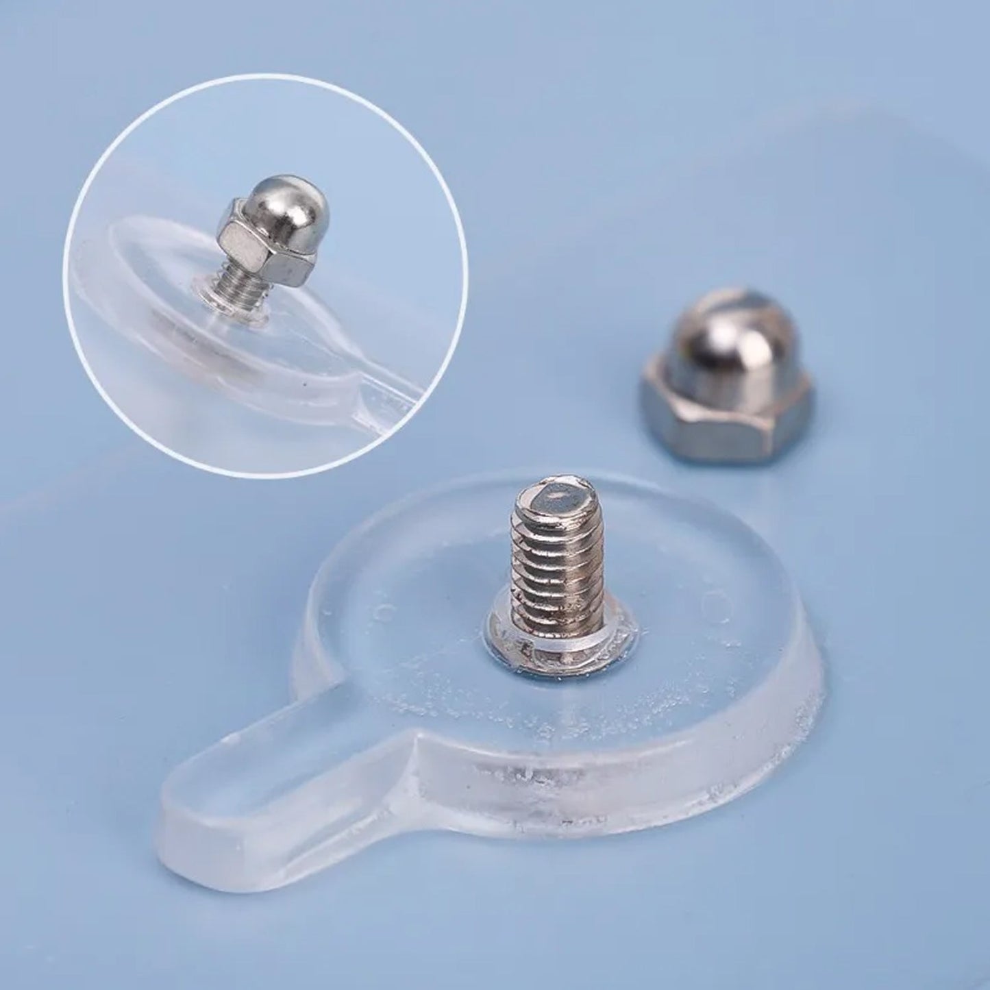 Close-up of metal peg on transparent self-adhesive wall hook
