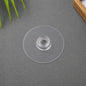 Transparent self-adhesive wall hook demonstrating strong hold