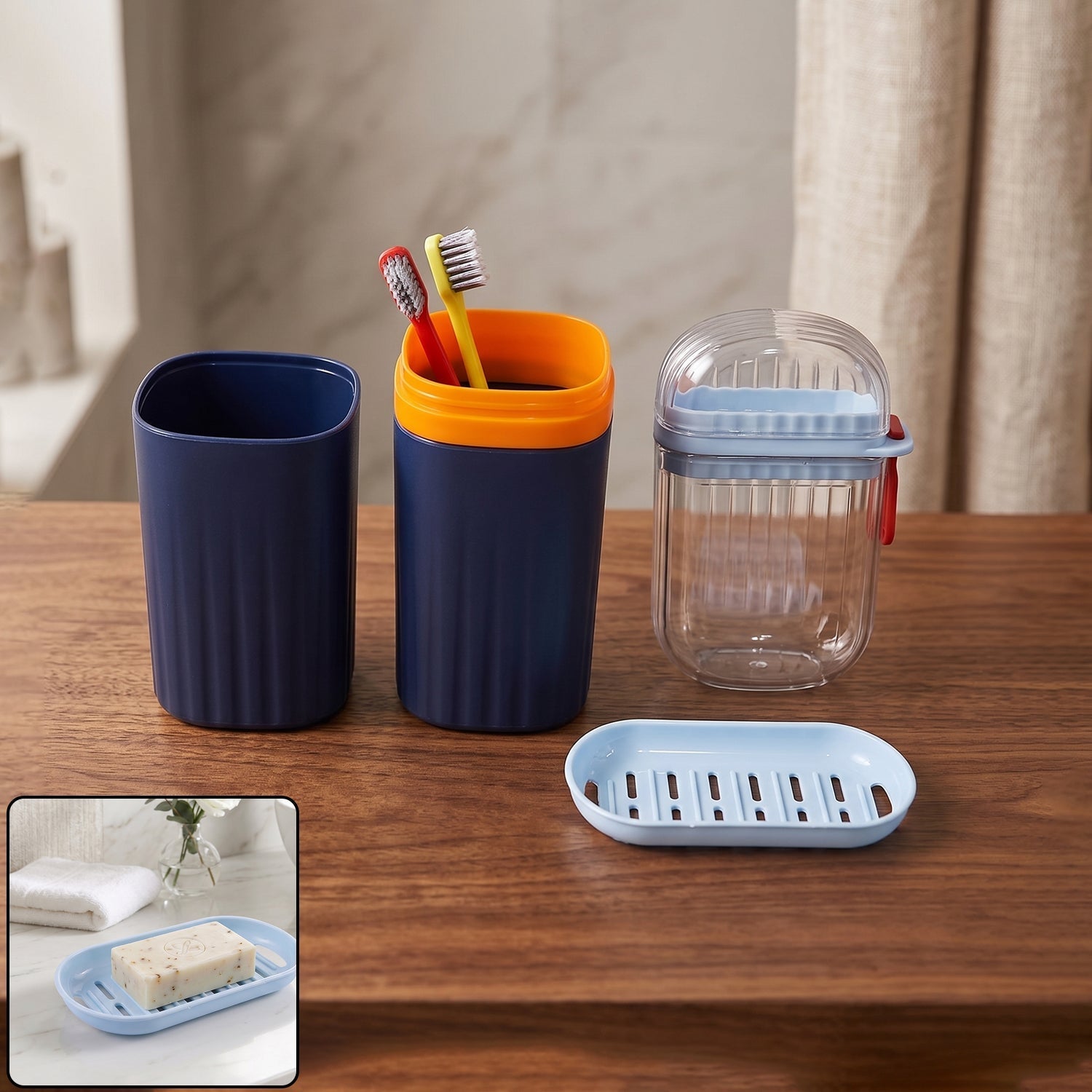 Tumbler, toothbrush holder, and soap dish in a modern bathroom accessories set