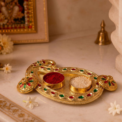 Golden Kumkum holder with intricate design on white background