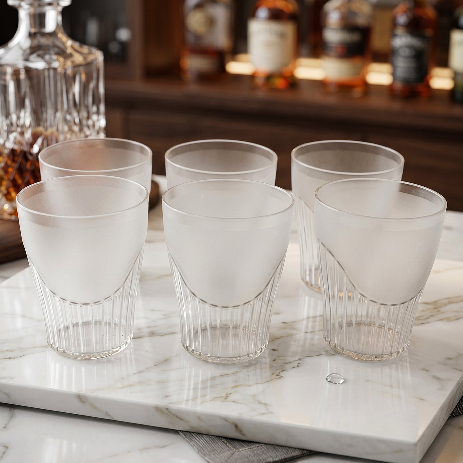 Close-up of frosted plastic juice glass with ribbed base detail