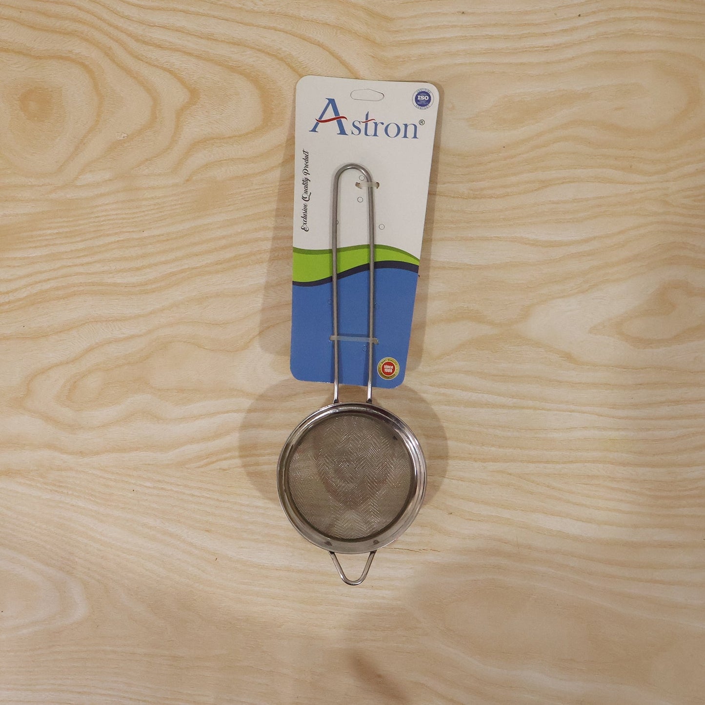 Tea strainer in daily kitchen use over a mug