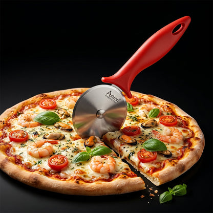 Pizza cutter in use on a fresh pizza
