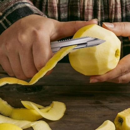 Close-up of knife blades and peeler in a kitchen set