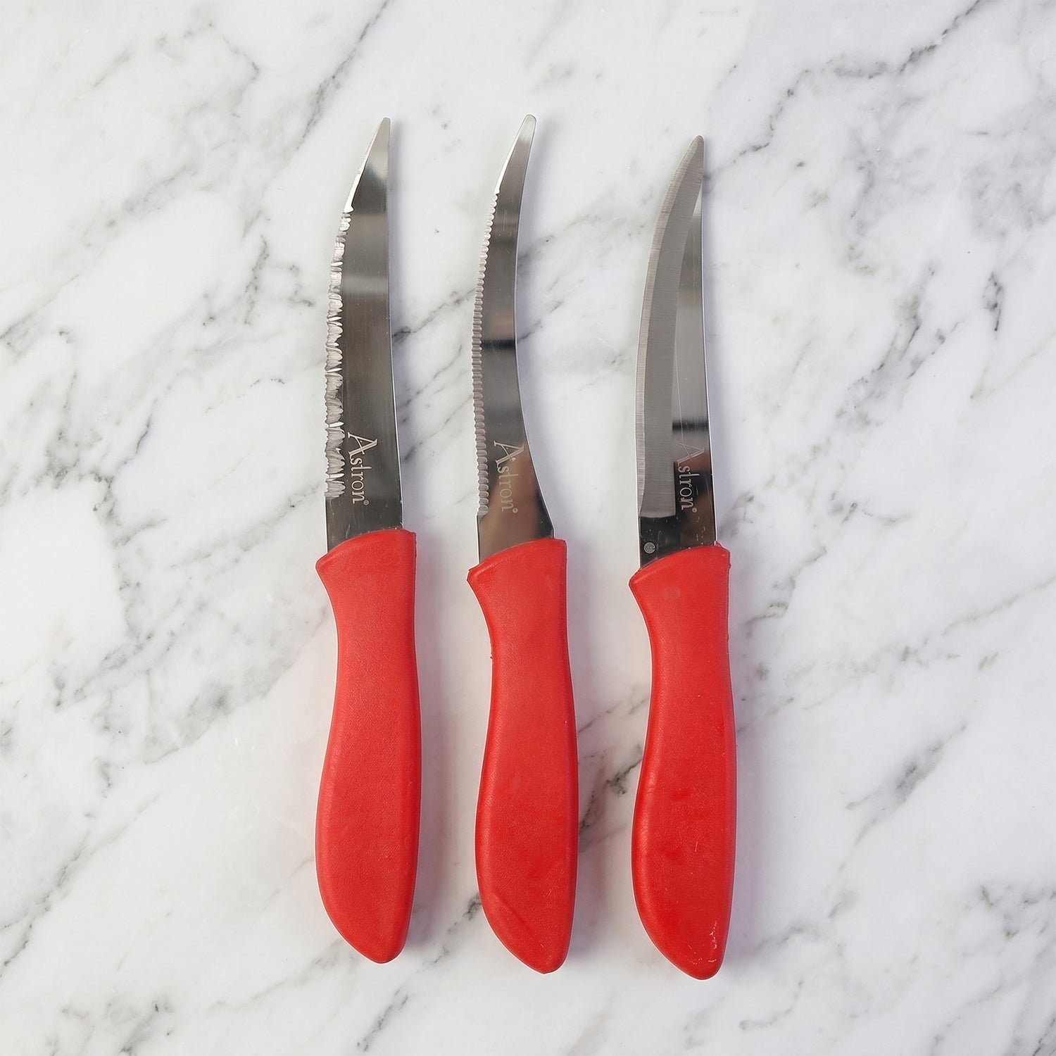 Kitchen knife slicing a tomato