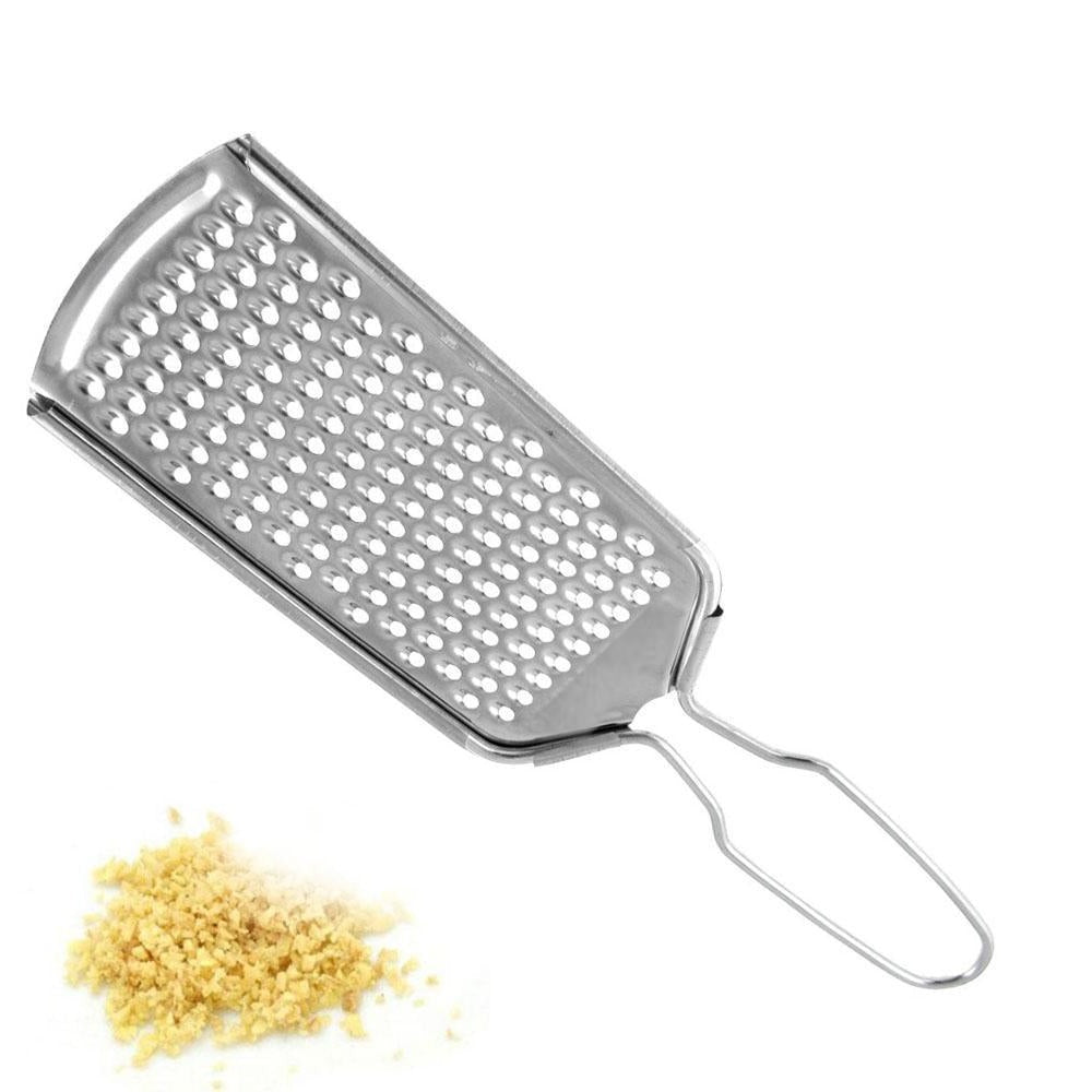 Steel grater for vegetables, cheese, and citrus zest in daily kitchen use