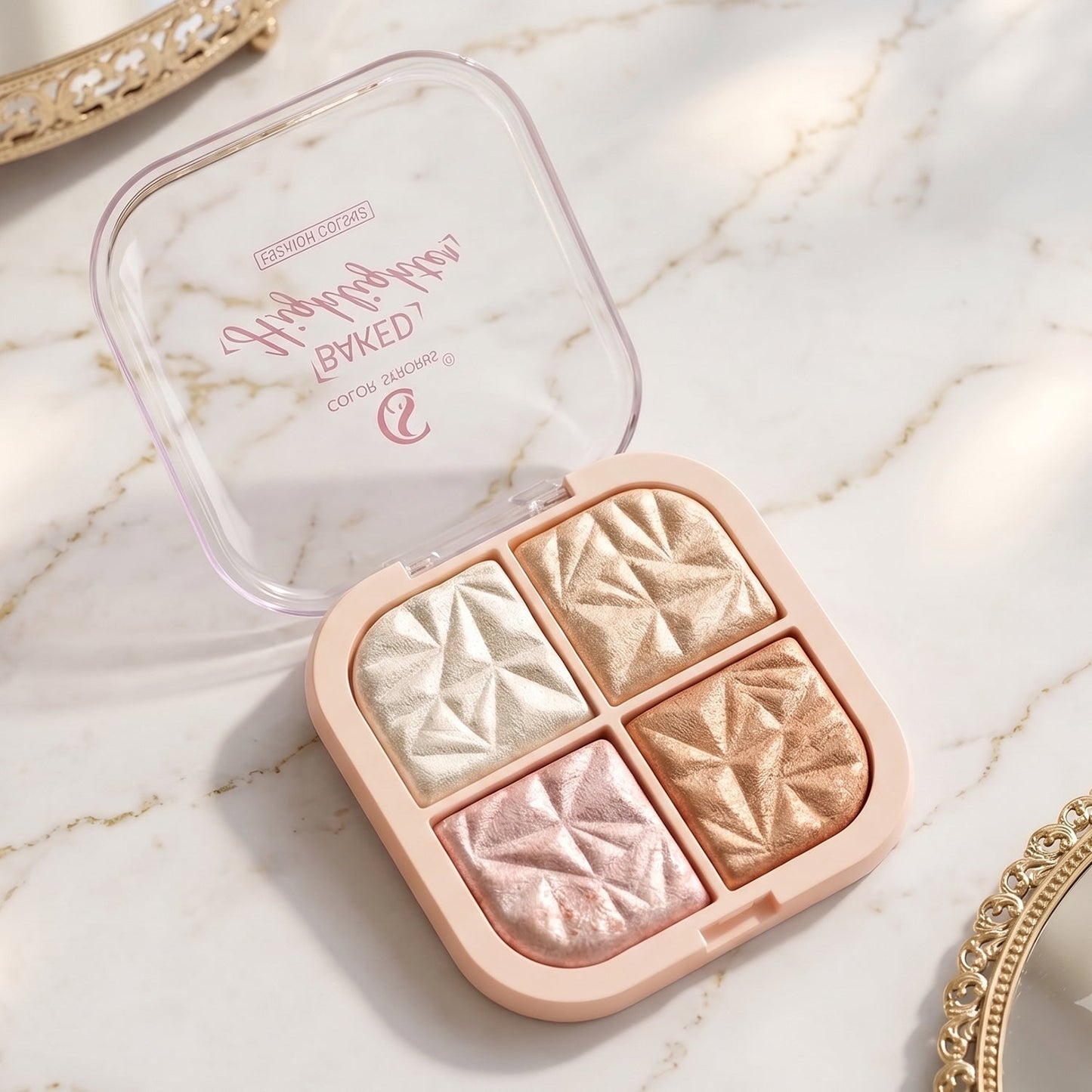 Swatches of highlighter palette shades with pearl, gold, rose, bronze