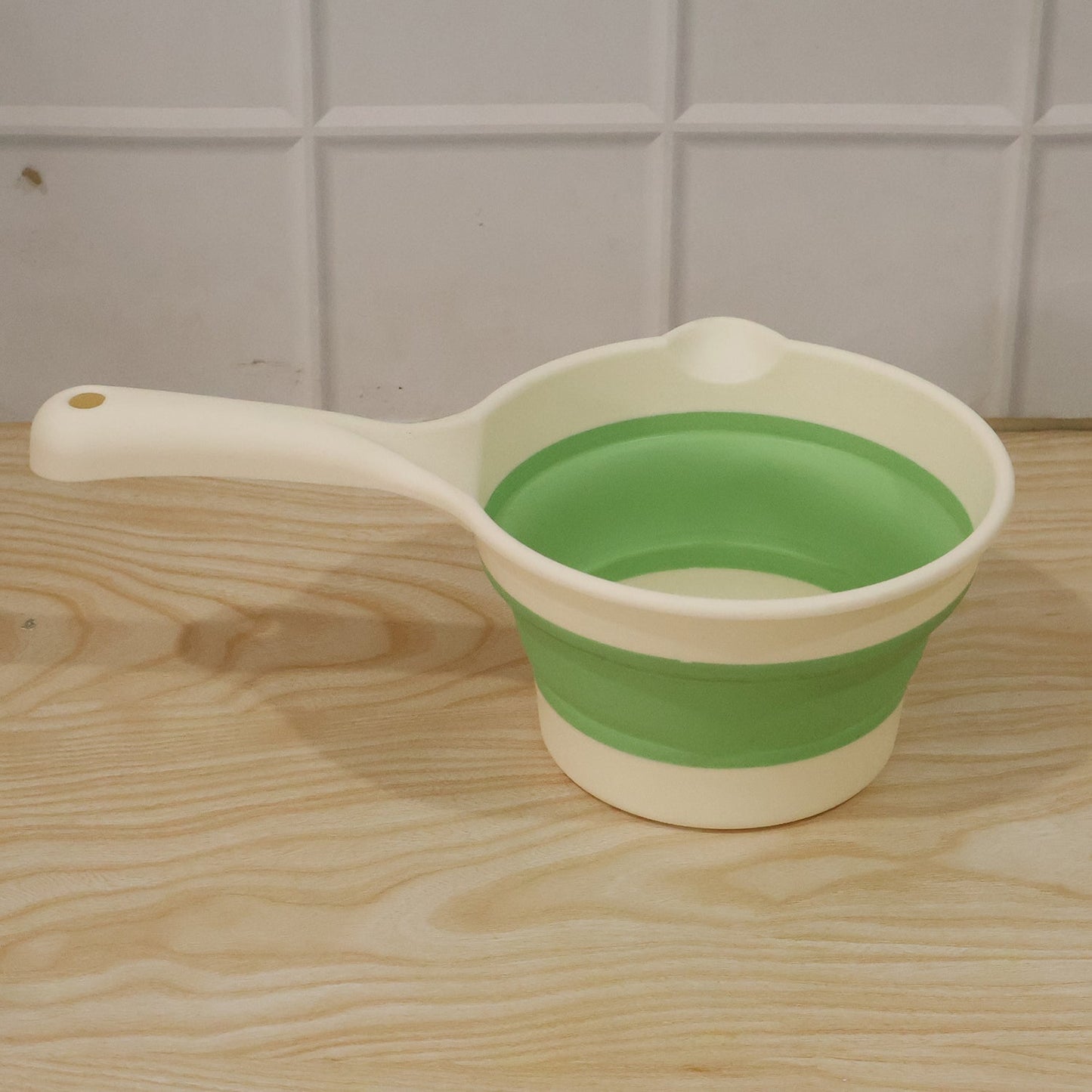 Foldable water dipper in action for home use