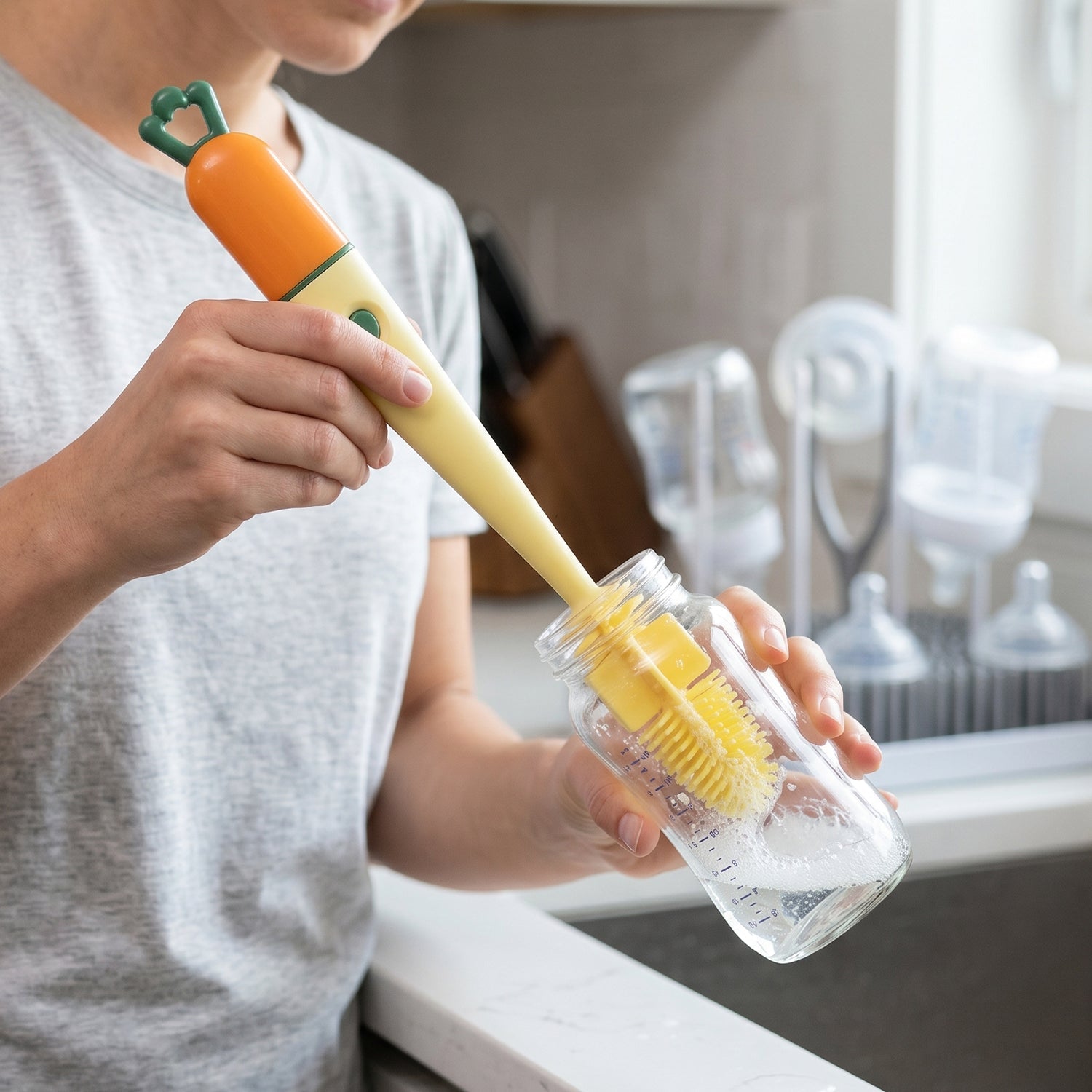 Cleaning bottles and flasks with a 3 in 1 silicone brush.
