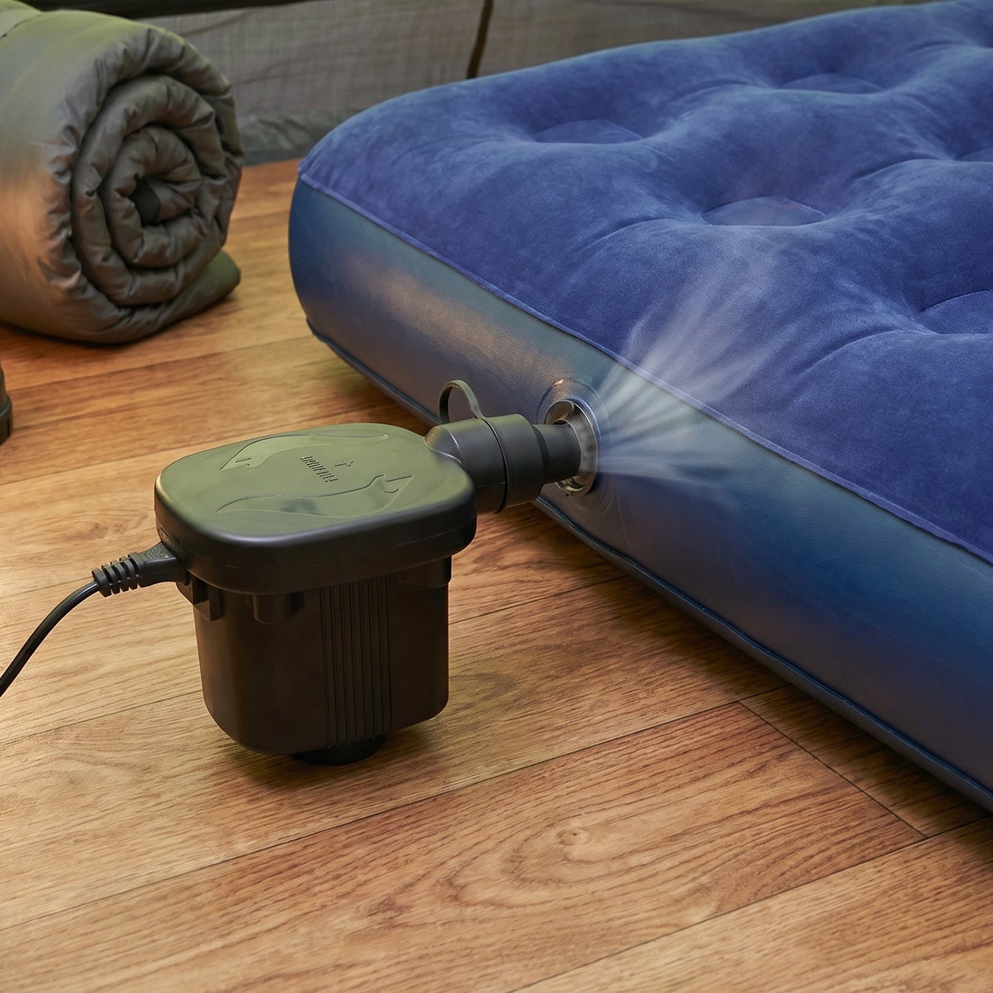 Pump inflating a pool float