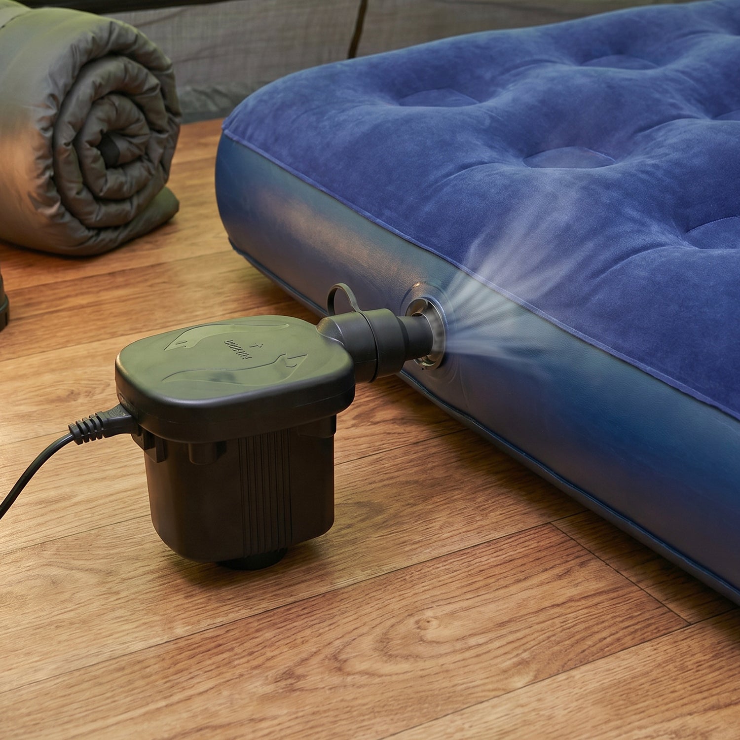 Pump inflating a pool float