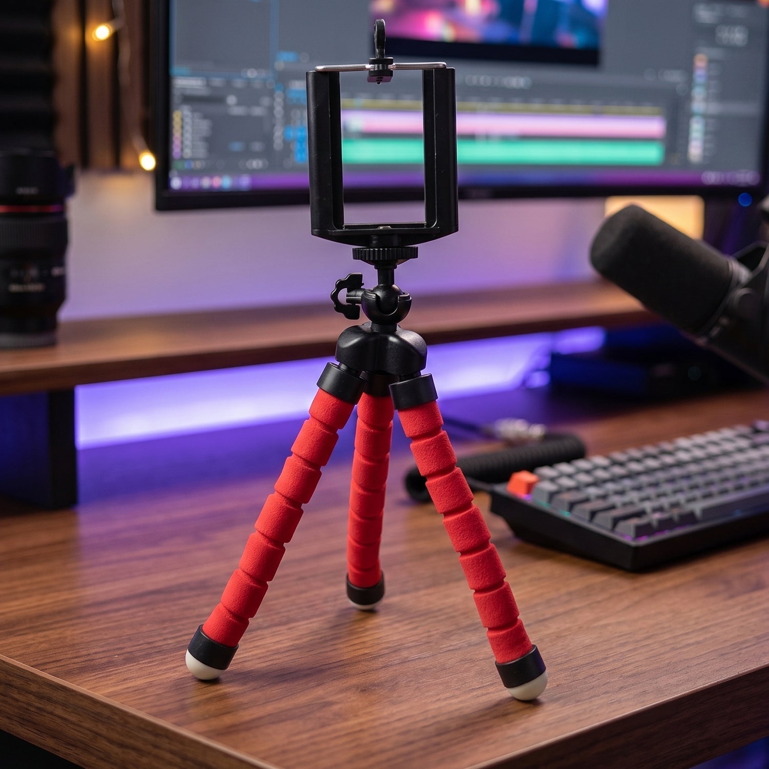 Close-up of tripod phone mount with adjustable clip and swivel head