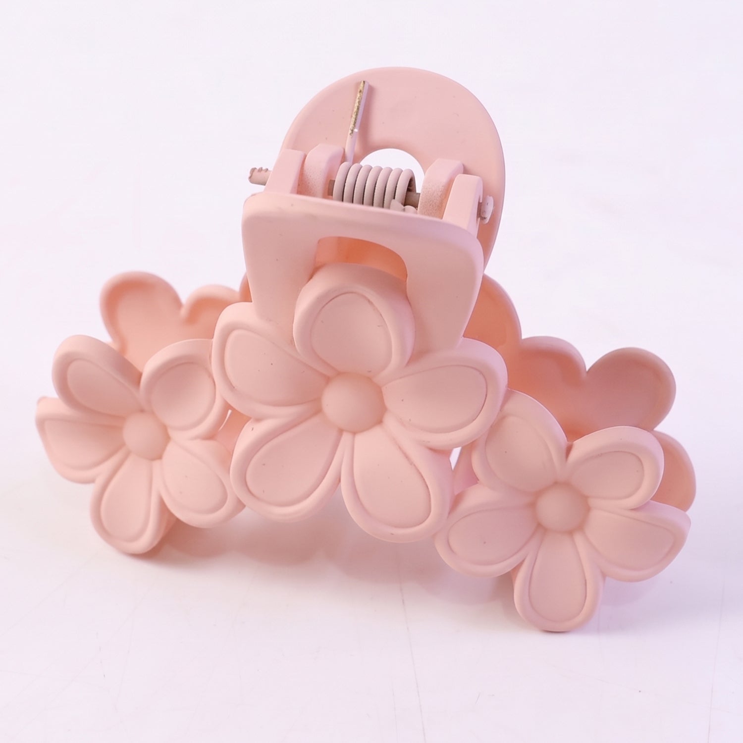 White background showing pink hair claw clip