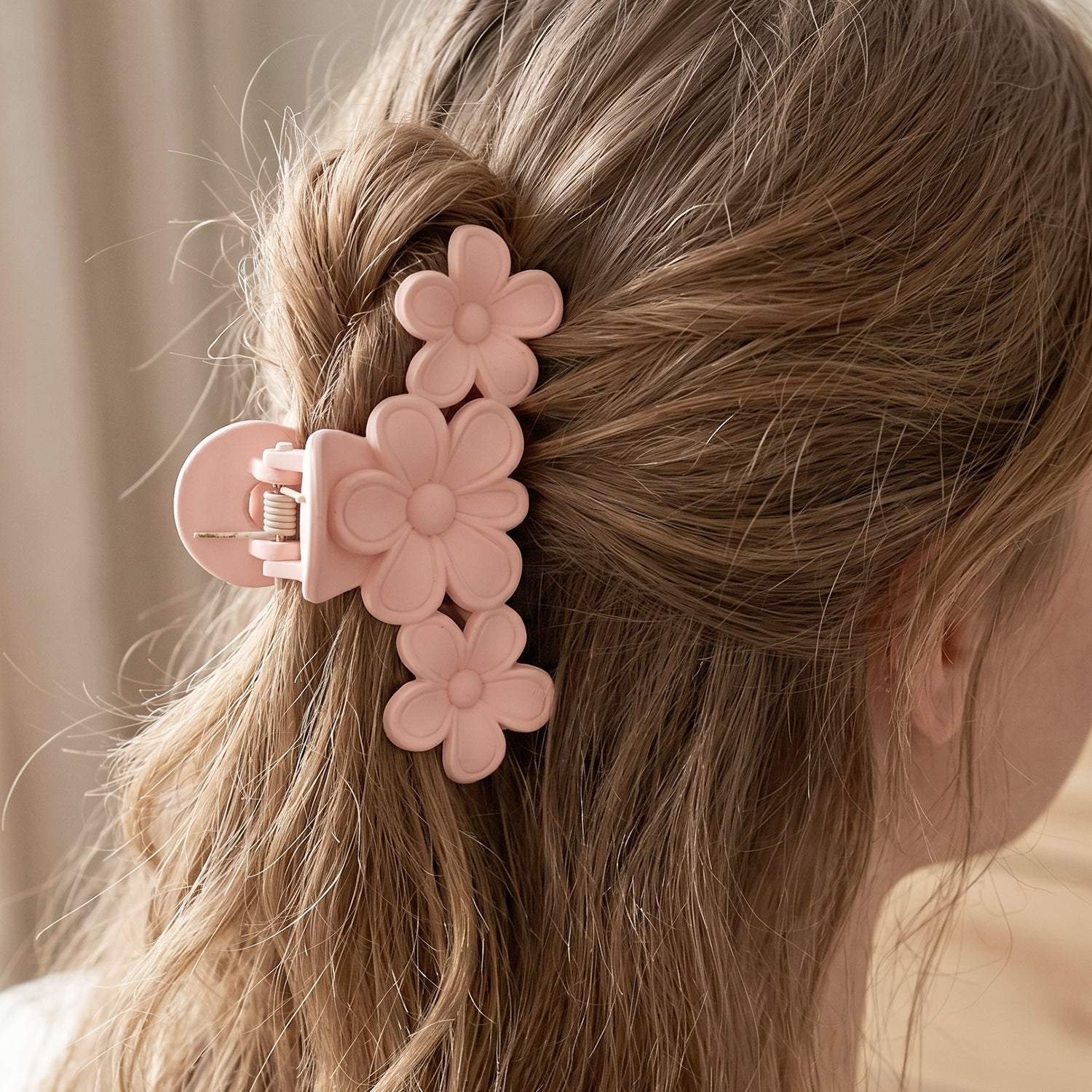 Hair styling with large floral hair clip