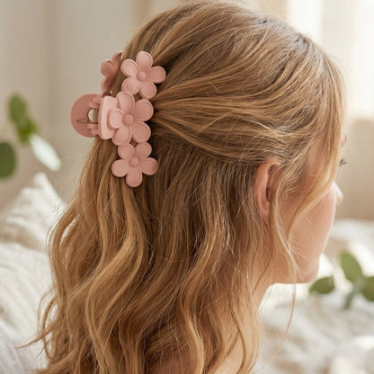 Model wearing large pink hair claw clip