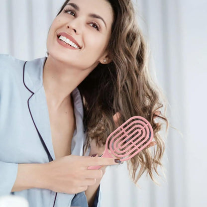Close-up of flexible bristles on curved vented hair brush for easy detangling