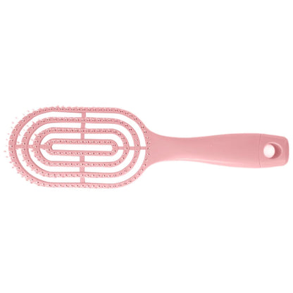 Detail of curved head and flexible bristles for scalp massage on hair brush