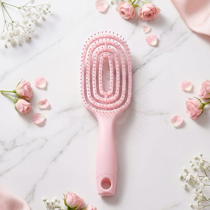 Side view showing ergonomic design of curved detangling hair brush
