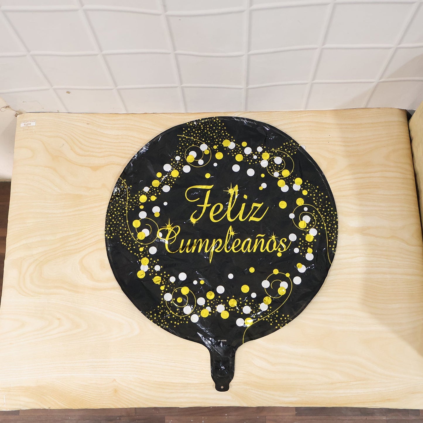 Party-ready black foil balloon for birthday festivities