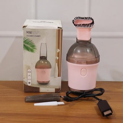 Mini vacuum cleaner in use on various surfaces