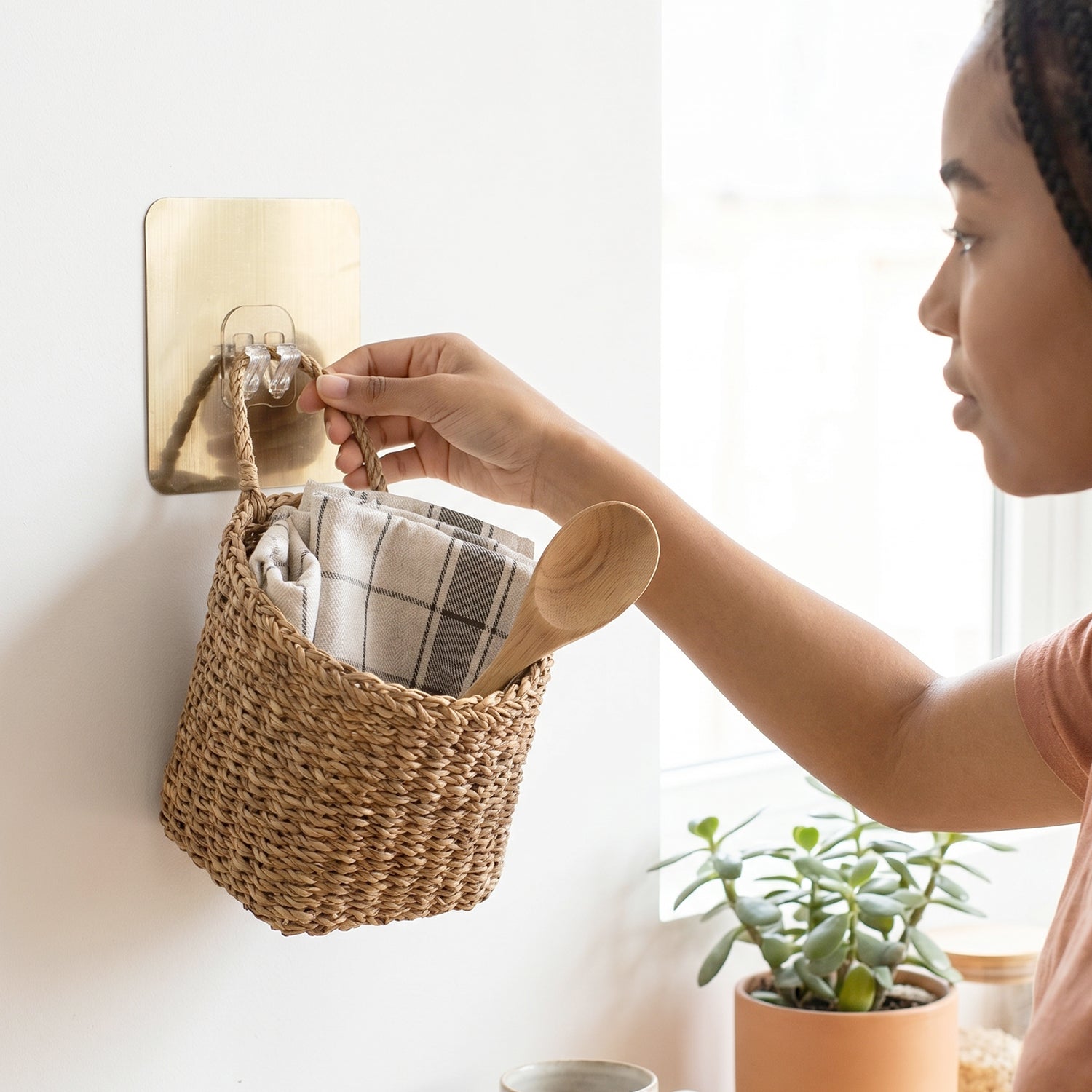 Everyday use of adhesive hook for organizing space