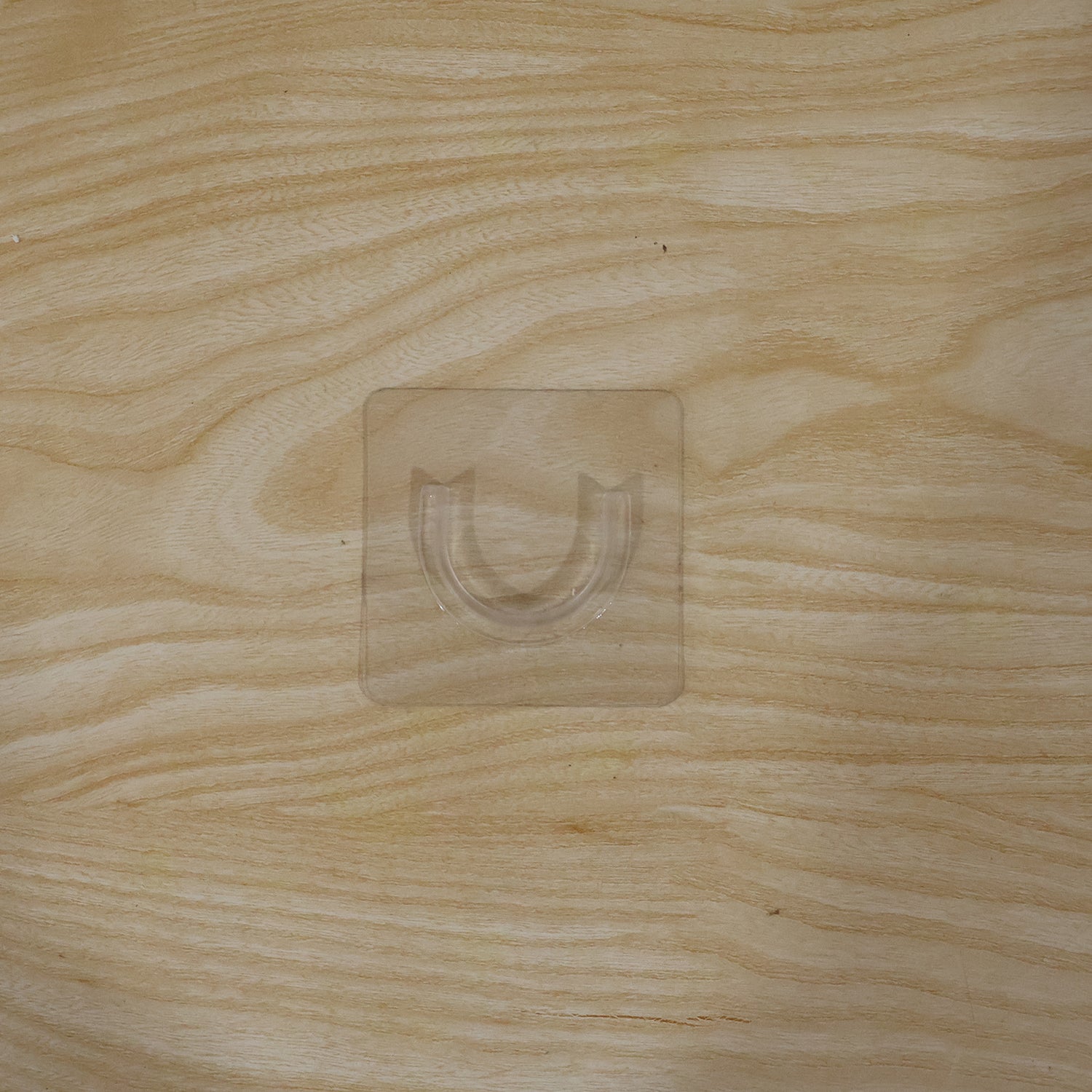 Durable adhesive wall hook for versatile home organization