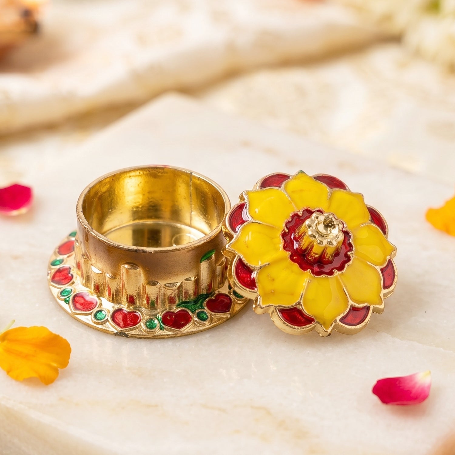 Traditional gold-finished kumkum box in religious ceremonies