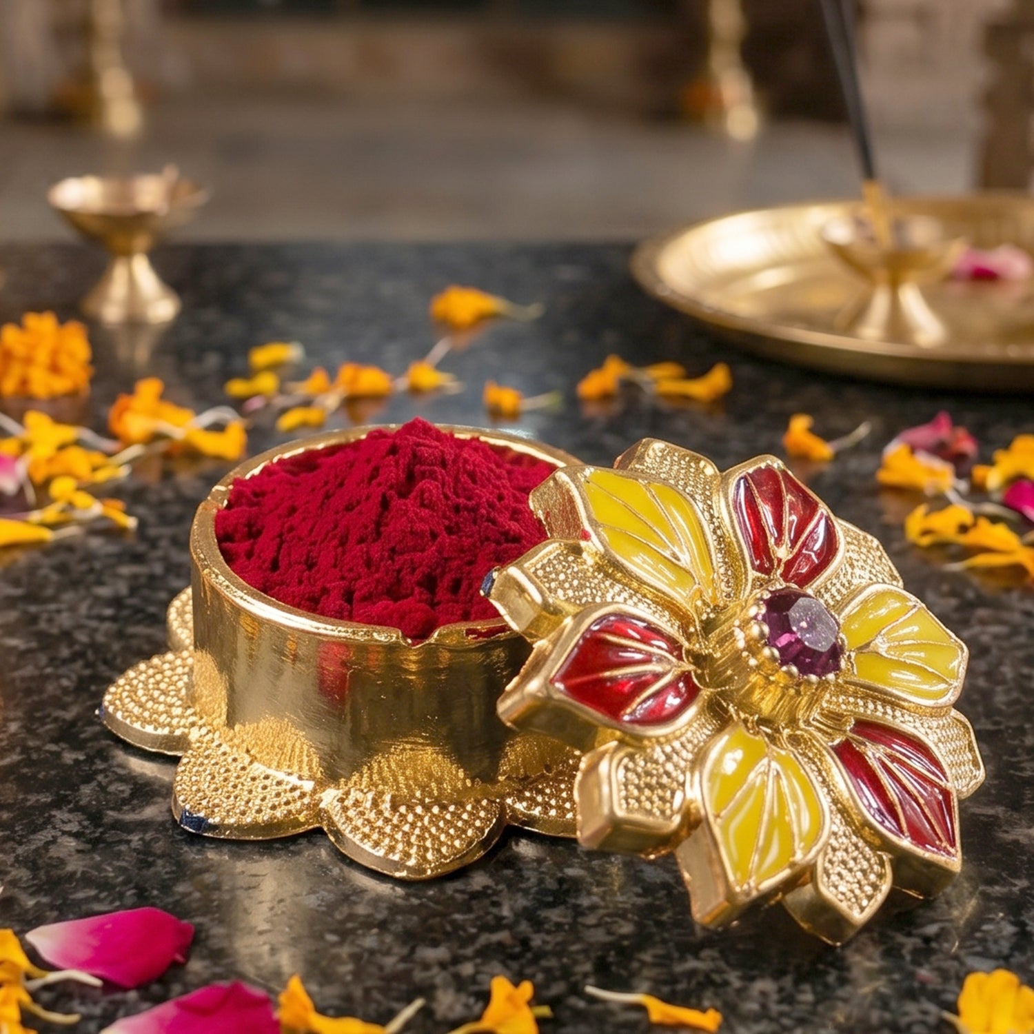 Premium golden kumkum box with intricate design