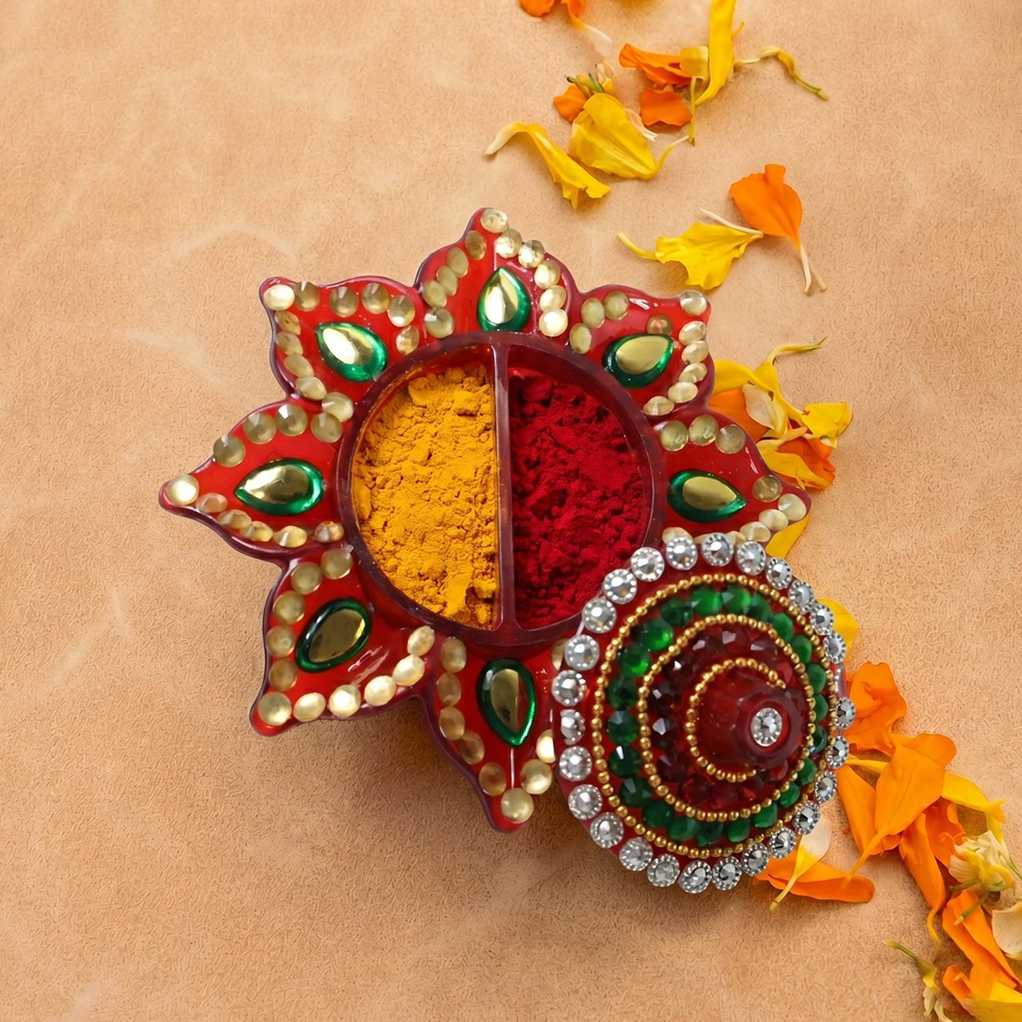 Close-up of the sparkling stone work on the lid of kumkum dani.