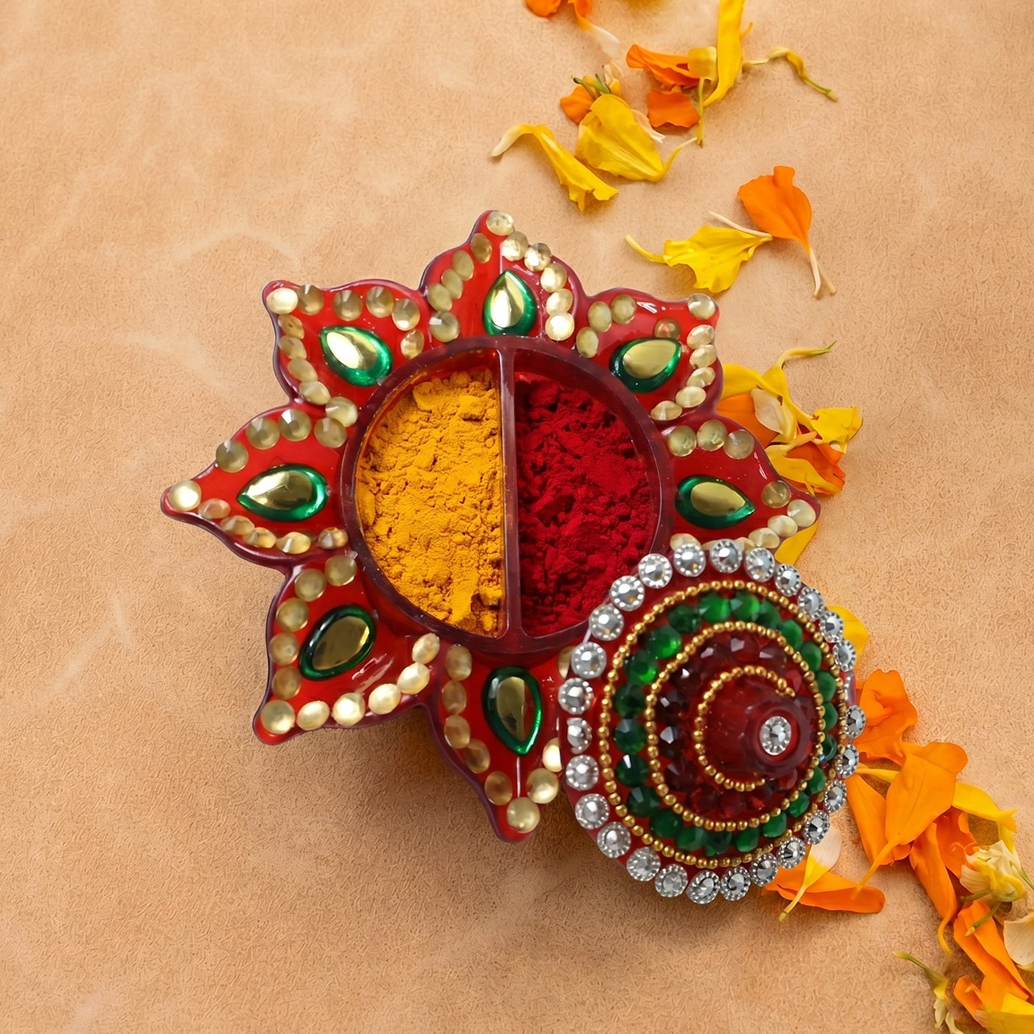Close-up of the sparkling stone work on the lid of kumkum dani.