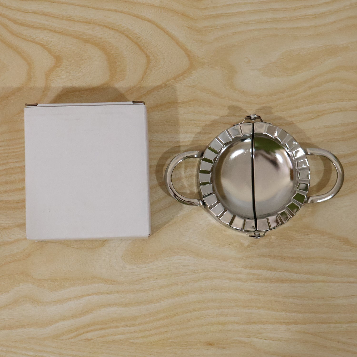 Daily use stainless steel dumpling maker on kitchen counter