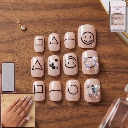 Woman showcasing glossy press-on nails for an elegant look.