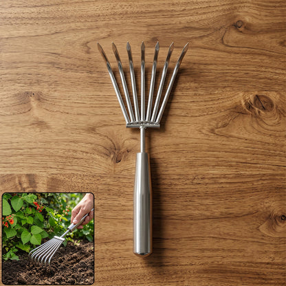 Garden rake in white background highlighting steel tines