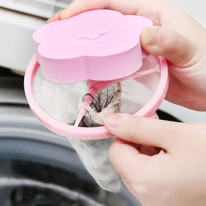 Hand holding flower-shaped lint remover showing collected lint