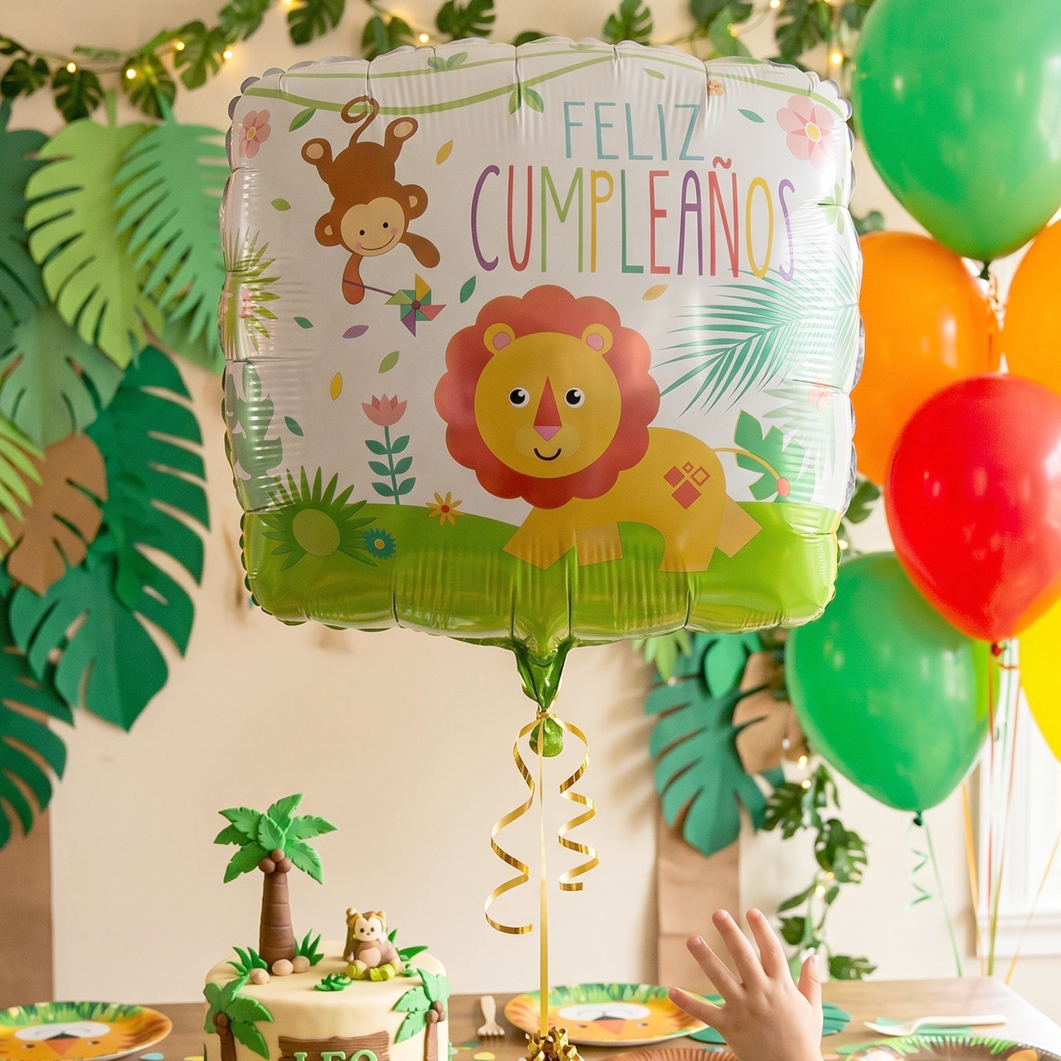 Cake table decorated with shiny lion foil balloon