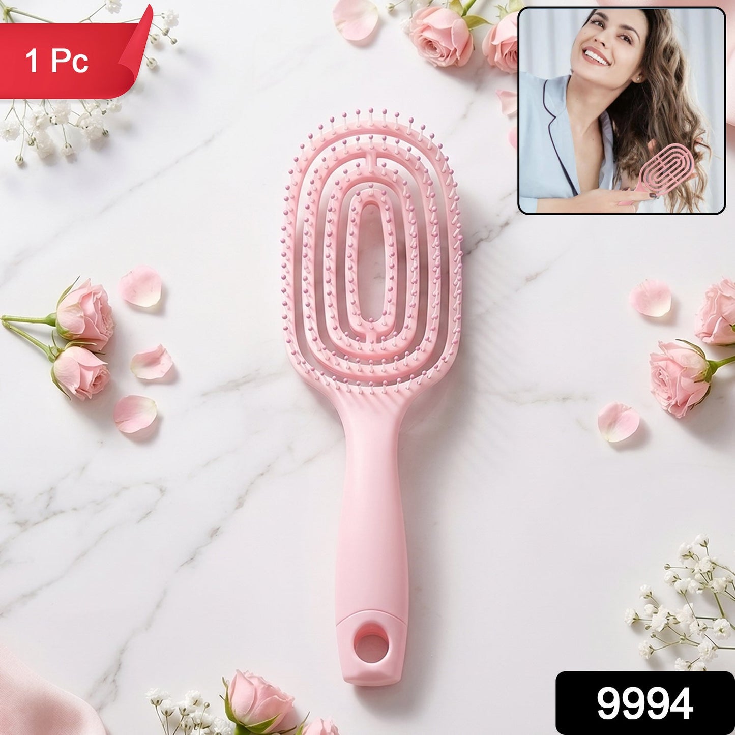 Pink detangling hair brush in packaging, suitable for all hair types