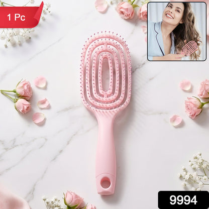 Pink detangling hair brush in packaging, suitable for all hair types