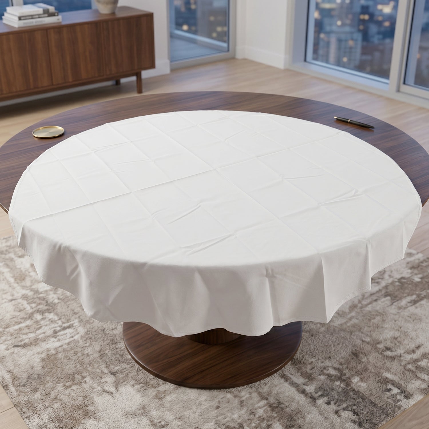 Folded round white table cover for storage and travel