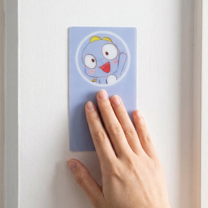 Plastic wall hook mounted on tiled bathroom wall